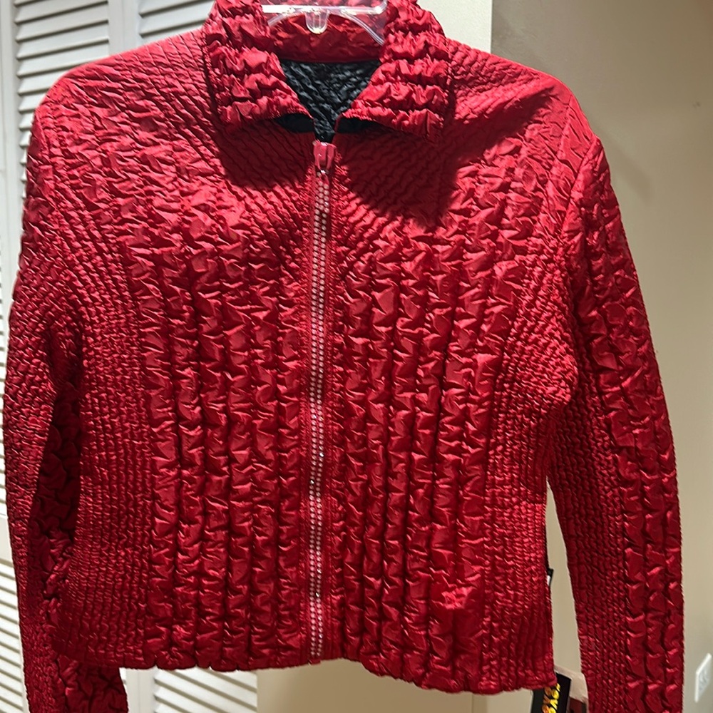 Quilted style polyester, reversible jacket with crystal zip